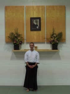 Shane standing at the Jiai Aikido Kamiza in San Diego